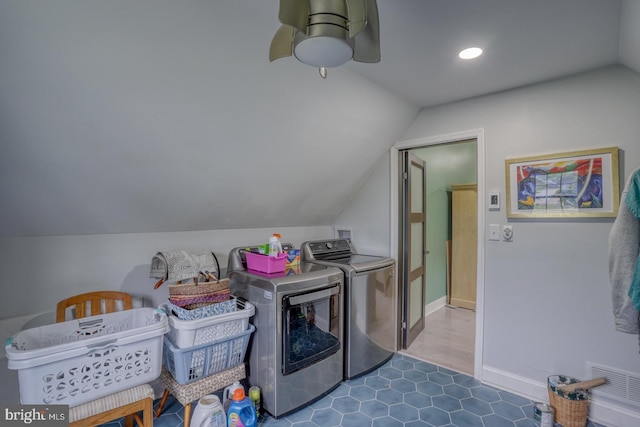 washroom featuring washing machine and dryer, a ceiling fan, recessed lighting, dark tile patterned floors, and baseboards