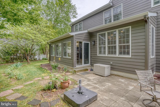 rear view of house with a patio