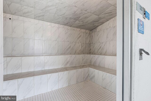 full bathroom with tiled shower