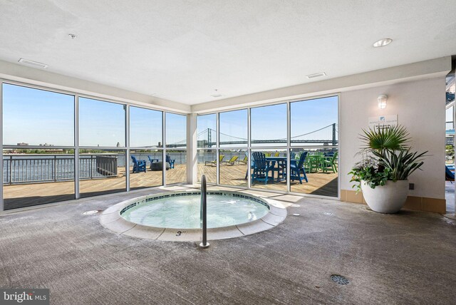 view of swimming pool featuring an indoor in ground hot tub