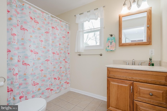 full bathroom with curtained shower, tile patterned flooring, vanity, and toilet