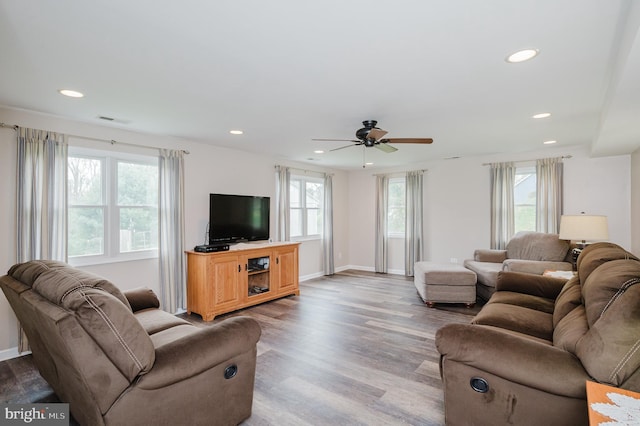 living area featuring wood finished floors, visible vents, a wealth of natural light, and recessed lighting