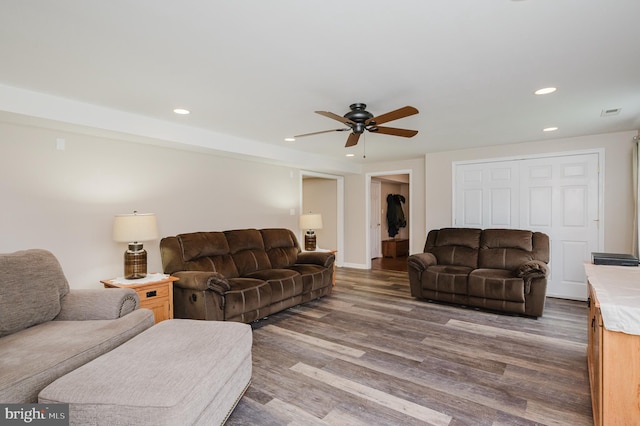 living area featuring recessed lighting, wood finished floors, baseboards, and ceiling fan