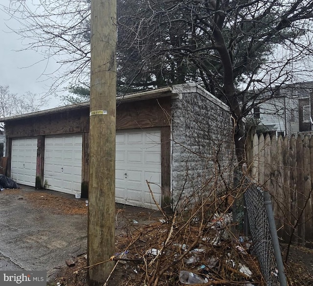garage featuring fence