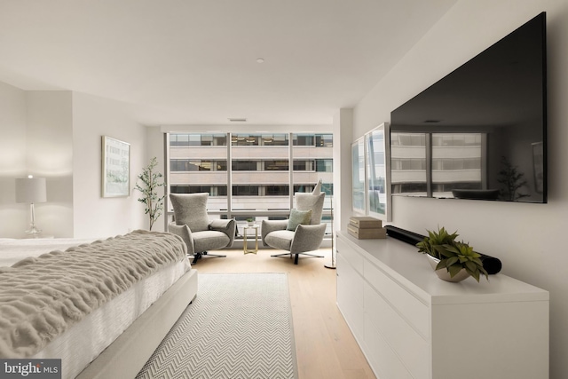 bedroom with wood finished floors