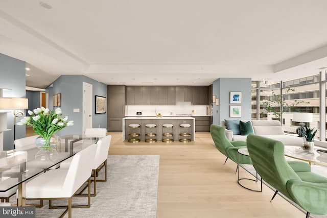 dining area with light wood-style flooring and recessed lighting