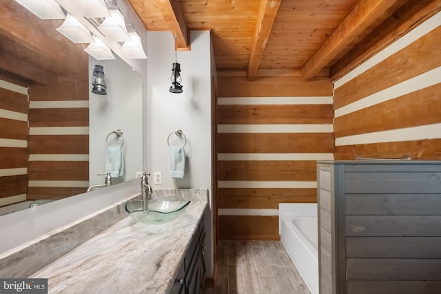 full bath featuring wood ceiling, wood walls, wood finished floors, vanity, and beamed ceiling