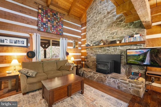 living room featuring a wood stove, beam ceiling, wooden ceiling, high vaulted ceiling, and wood-type flooring