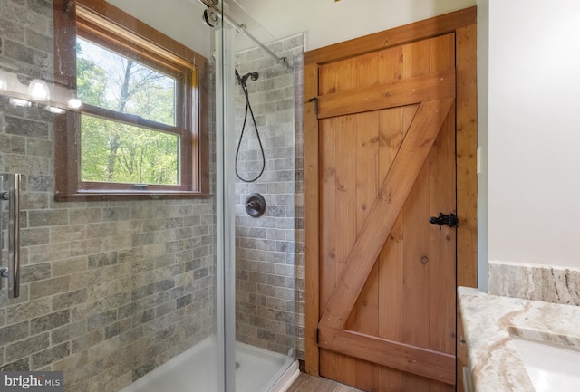 full bath with a shower stall