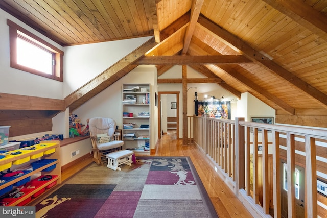 playroom with lofted ceiling with beams, wooden ceiling, and wood-type flooring