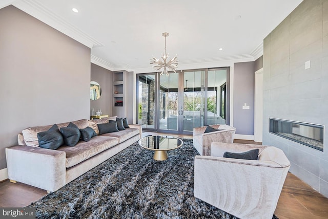 1109 Towlston Rd, Mclean, VA 22102 - living area with built in features, a tiled fireplace, recessed lighting, wood finished floors, and ornamental molding