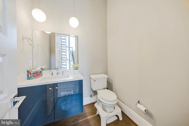 1109 Towlston Rd, Mclean, VA 22102 - bathroom featuring baseboards, vanity, toilet, and wood finished floors