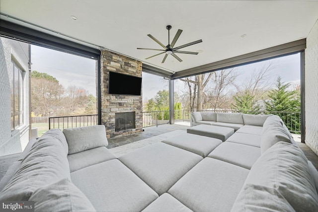 1109 Towlston Rd, Mclean, VA 22102 - living area with an outdoor stone fireplace and a ceiling fan