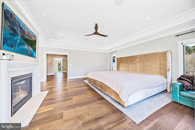 1109 Towlston Rd, Mclean, VA 22102 - bedroom featuring ornamental molding, wood finished floors, a fireplace, baseboards, and a tray ceiling