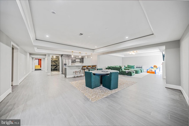 1109 Towlston Rd, Mclean, VA 22102 - living area with light wood finished floors, recessed lighting, baseboards, a tray ceiling, and visible vents