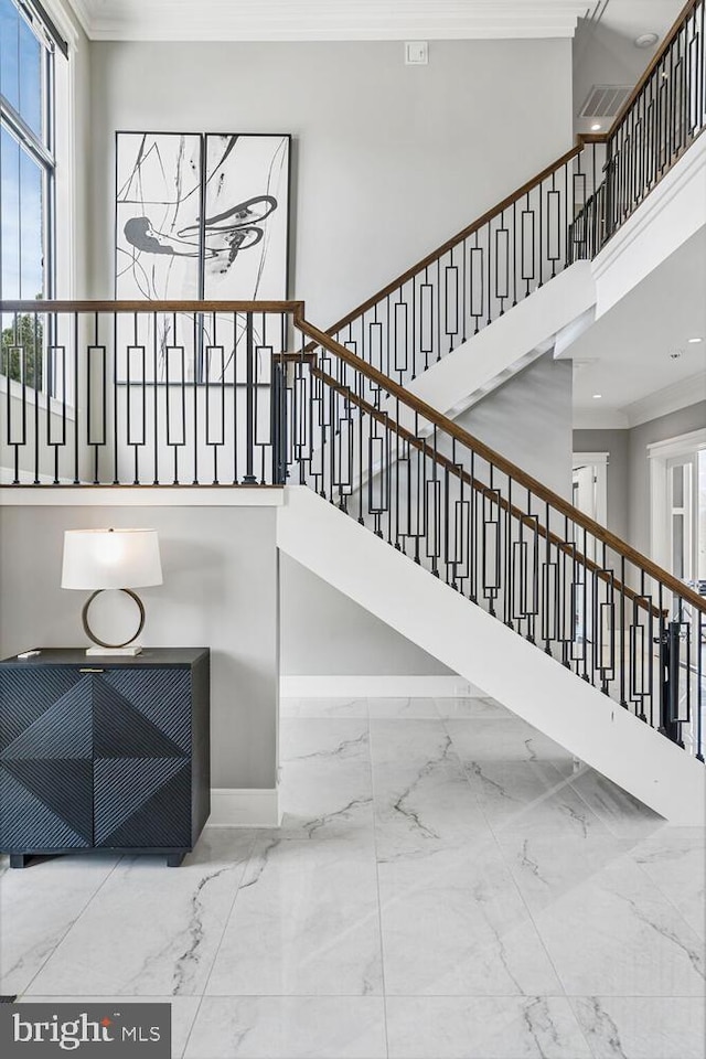 1109 Towlston Rd, Mclean, VA 22102 - stairway featuring baseboards, a high ceiling, ornamental molding, and marble finish floor