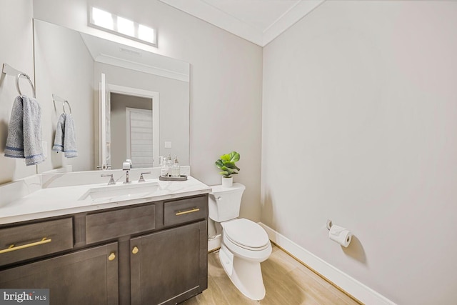 1109 Towlston Rd, Mclean, VA 22102 - bathroom with crown molding, vanity, toilet, baseboards, and wood finished floors