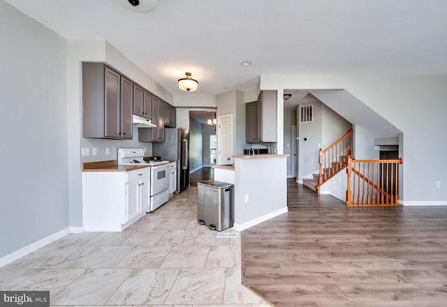62 Brookview Ln, Pottstown, PA 19464 - kitchen featuring appliances with stainless steel finishes, under cabinet range hood, light countertops, and open floor plan