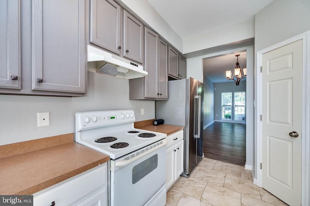 62 Brookview Ln, Pottstown, PA 19464 - kitchen featuring white electric range, under cabinet range hood, a chandelier, gray cabinets, and high quality fridge