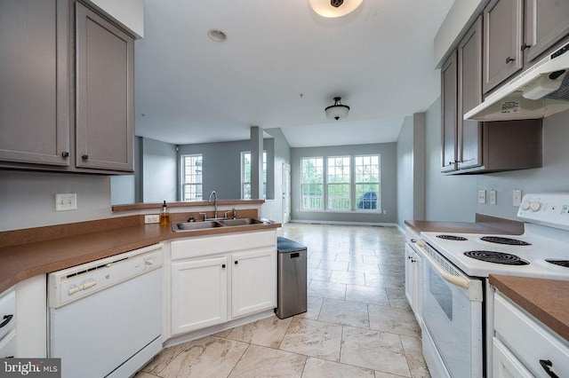 62 Brookview Ln, Pottstown, PA 19464 - kitchen featuring white appliances, gray cabinetry, under cabinet range hood, and healthy amount of natural light