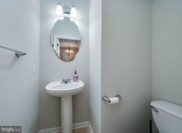 62 Brookview Ln, Pottstown, PA 19464 - half bath with toilet and a chandelier