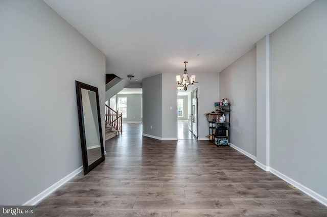 62 Brookview Ln, Pottstown, PA 19464 - unfurnished dining area with a chandelier, wood finished floors, and stairway