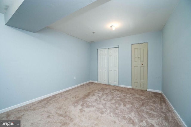 62 Brookview Ln, Pottstown, PA 19464 - unfurnished bedroom featuring carpet flooring and two closets
