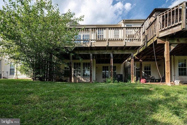 62 Brookview Ln, Pottstown, PA 19464 - rear view of property featuring a wooden deck and a lawn