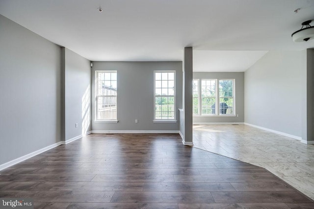62 Brookview Ln, Pottstown, PA 19464 - empty room with plenty of natural light and dark wood finished floors