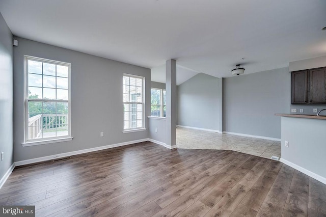 62 Brookview Ln, Pottstown, PA 19464 - unfurnished living room featuring dark wood-type flooring and baseboards