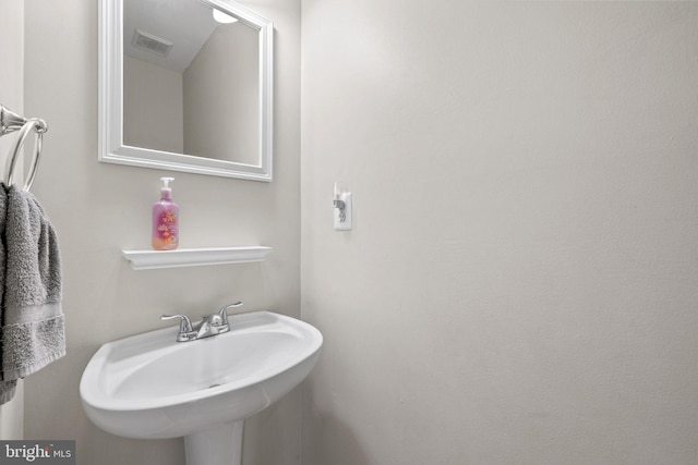 bathroom featuring a sink and visible vents