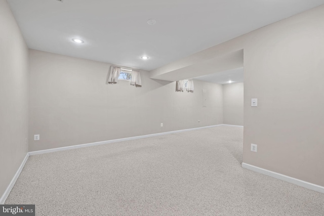 basement with recessed lighting, baseboards, and carpet