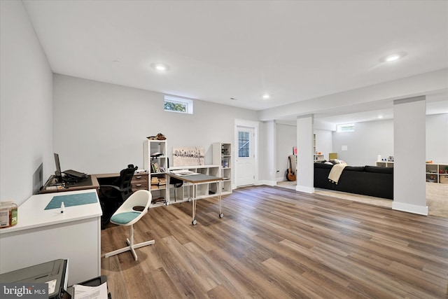 office featuring baseboards, wood finished floors, and recessed lighting