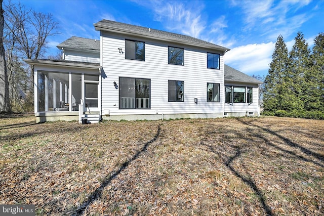 back of house featuring a sunroom