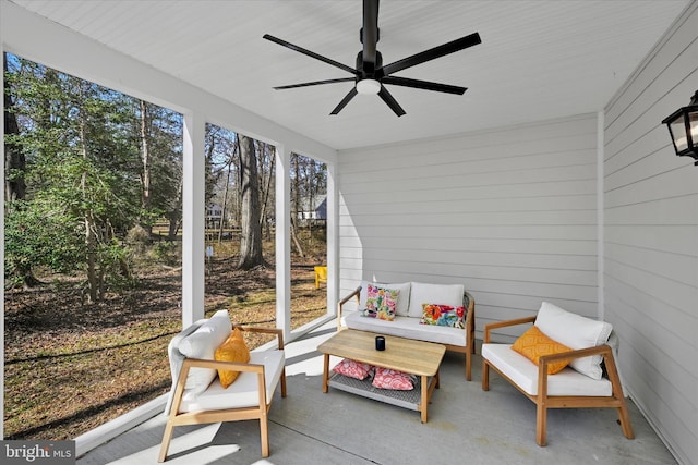 sunroom with an outdoor living space and ceiling fan