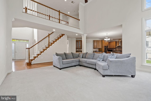 18547 Kerill Rd, Triangle, VA 22172 - living room with a towering ceiling, baseboards, light carpet, stairway, and recessed lighting