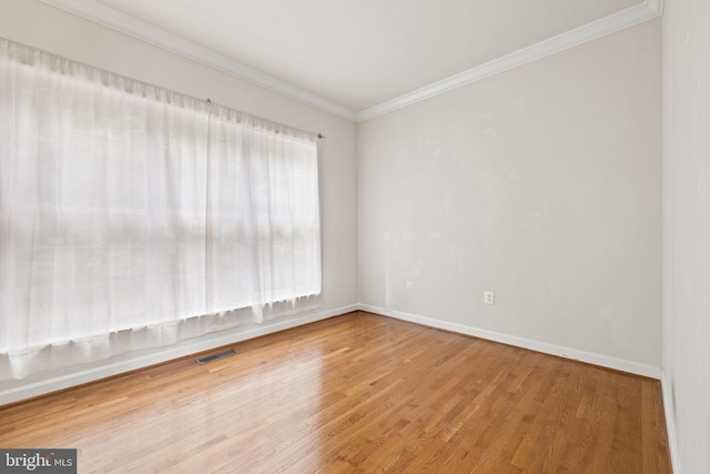 18547 Kerill Rd, Triangle, VA 22172 - empty room featuring wood finished floors, ornamental molding, and baseboards