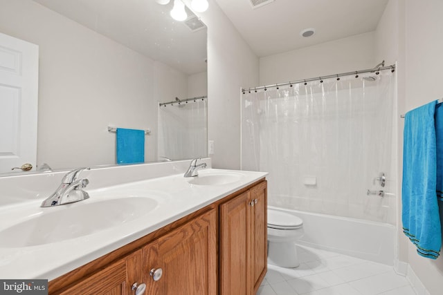 18547 Kerill Rd, Triangle, VA 22172 - bathroom with double vanity, shower / bath combo, tile patterned floors, and toilet