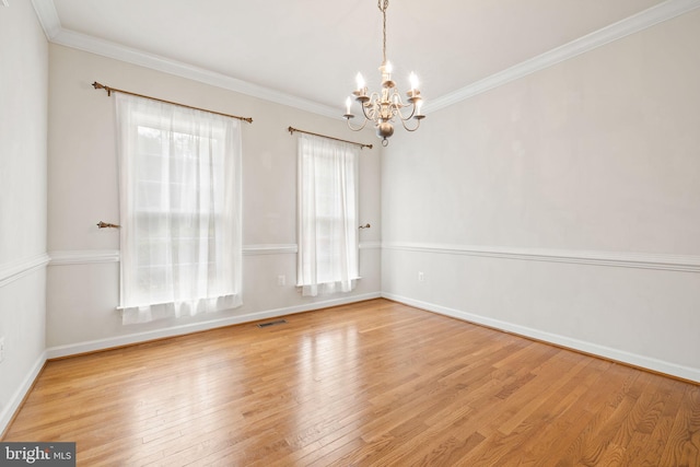 18547 Kerill Rd, Triangle, VA 22172 - empty room featuring a chandelier, wood finished floors, baseboards, and crown molding