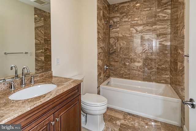 bathroom with toilet, shower / bathing tub combination, and vanity