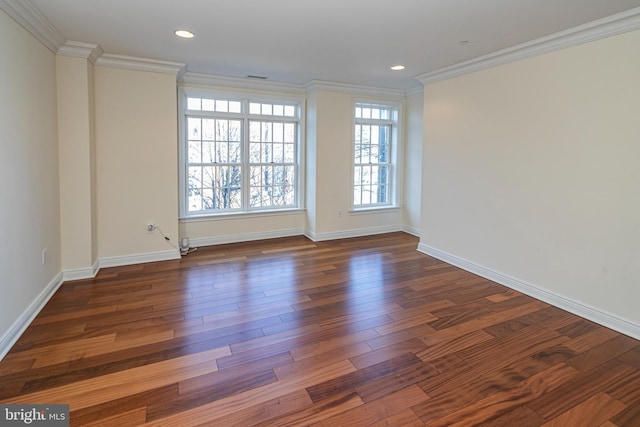 unfurnished room with dark wood finished floors, baseboards, visible vents, ornamental molding, and recessed lighting