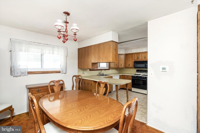 dining area featuring light floors and a chandelier