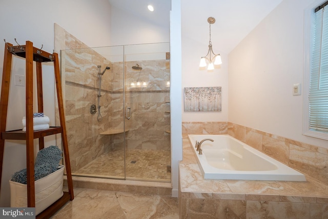 bathroom with a garden tub, a notable chandelier, and a shower stall