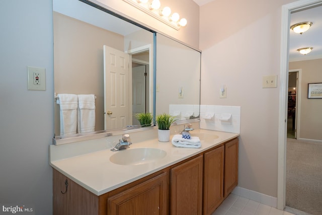 full bathroom featuring a sink and double vanity