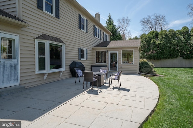 view of patio featuring fence