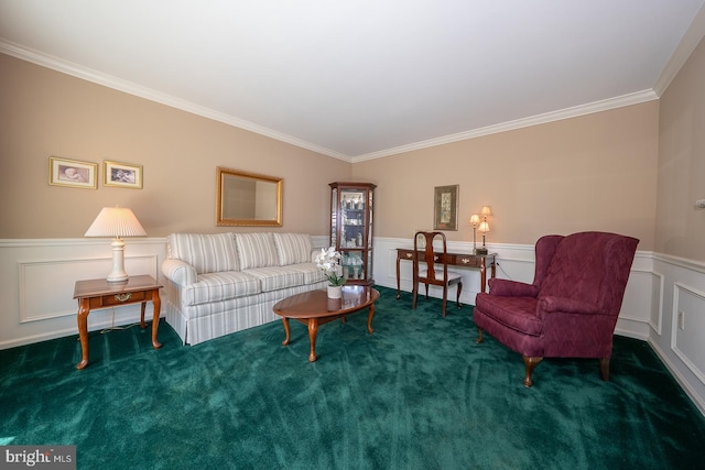 living area featuring wainscoting, ornamental molding, carpet, and a decorative wall