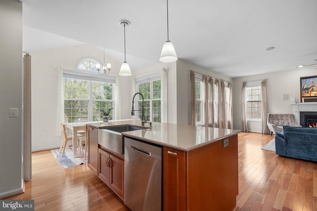 63 Woodleigh Ln, Stafford, VA 22556 - kitchen featuring light wood-style floors, a sink, stainless steel dishwasher, and open floor plan