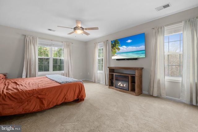 63 Woodleigh Ln, Stafford, VA 22556 - bedroom with carpet floors, a glass covered fireplace, ceiling fan, and visible vents