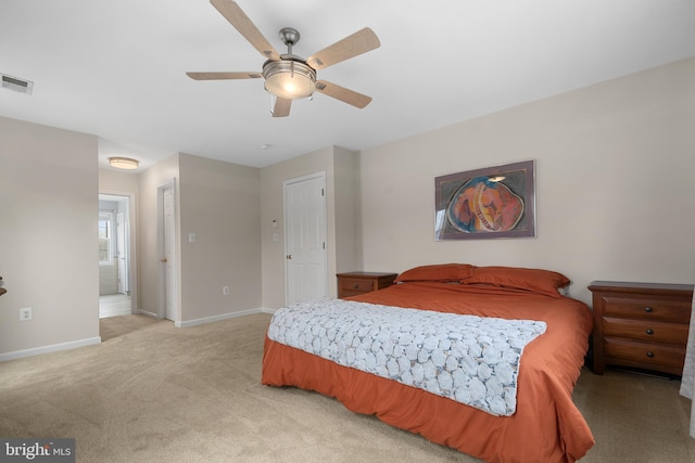 63 Woodleigh Ln, Stafford, VA 22556 - bedroom featuring light colored carpet, baseboards, ensuite bath, ceiling fan, and visible vents