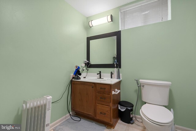 63 Woodleigh Ln, Stafford, VA 22556 - bathroom with baseboards, toilet, radiator heating unit, and vanity
